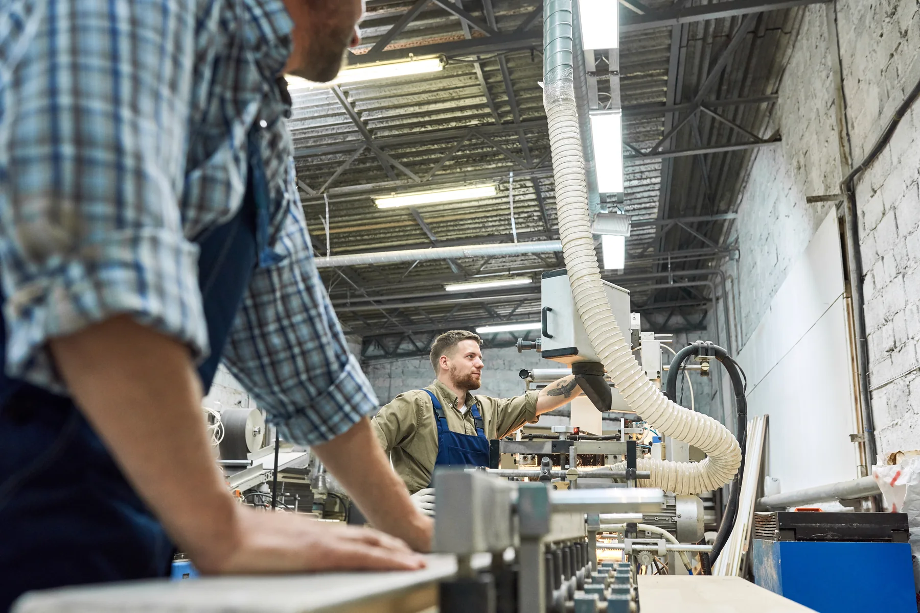 Traditional manufacturing people and equipment